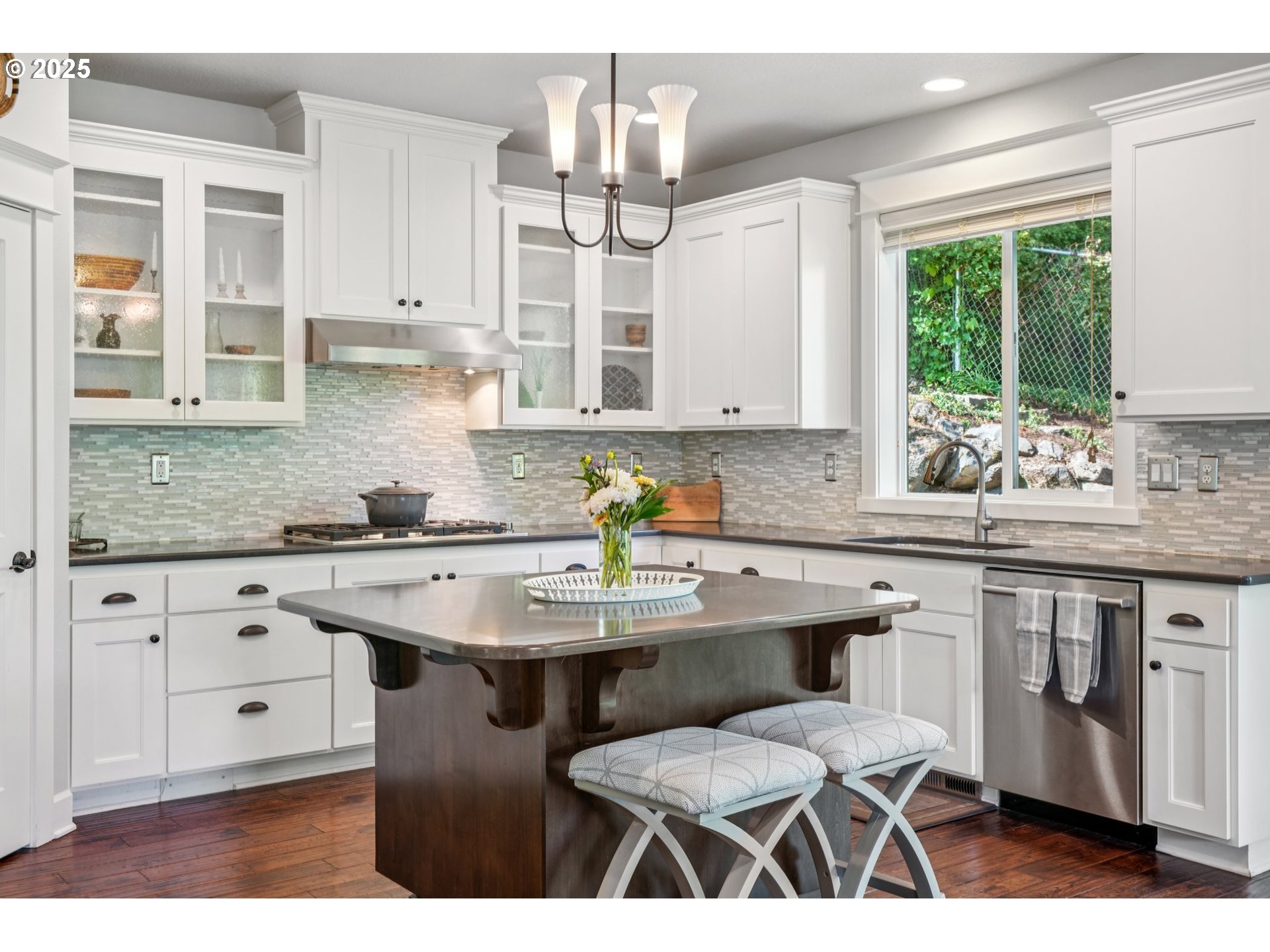 5862 Southwest Ralston Drive Portland, OR 97239 - Photo 11 of 41 a kitchen with stainless steel appliances granite countertop a sink stove and cabinets