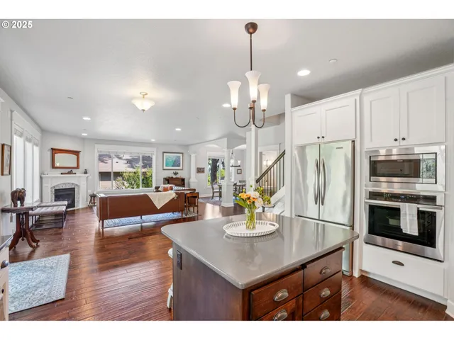 a kitchen with stainless steel appliances a refrigerator and a stove