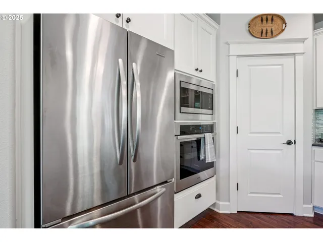 a kitchen with granite countertop a sink and cabinets