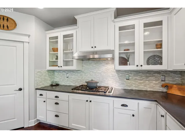 a bathroom with a sink a mirror and vanity
