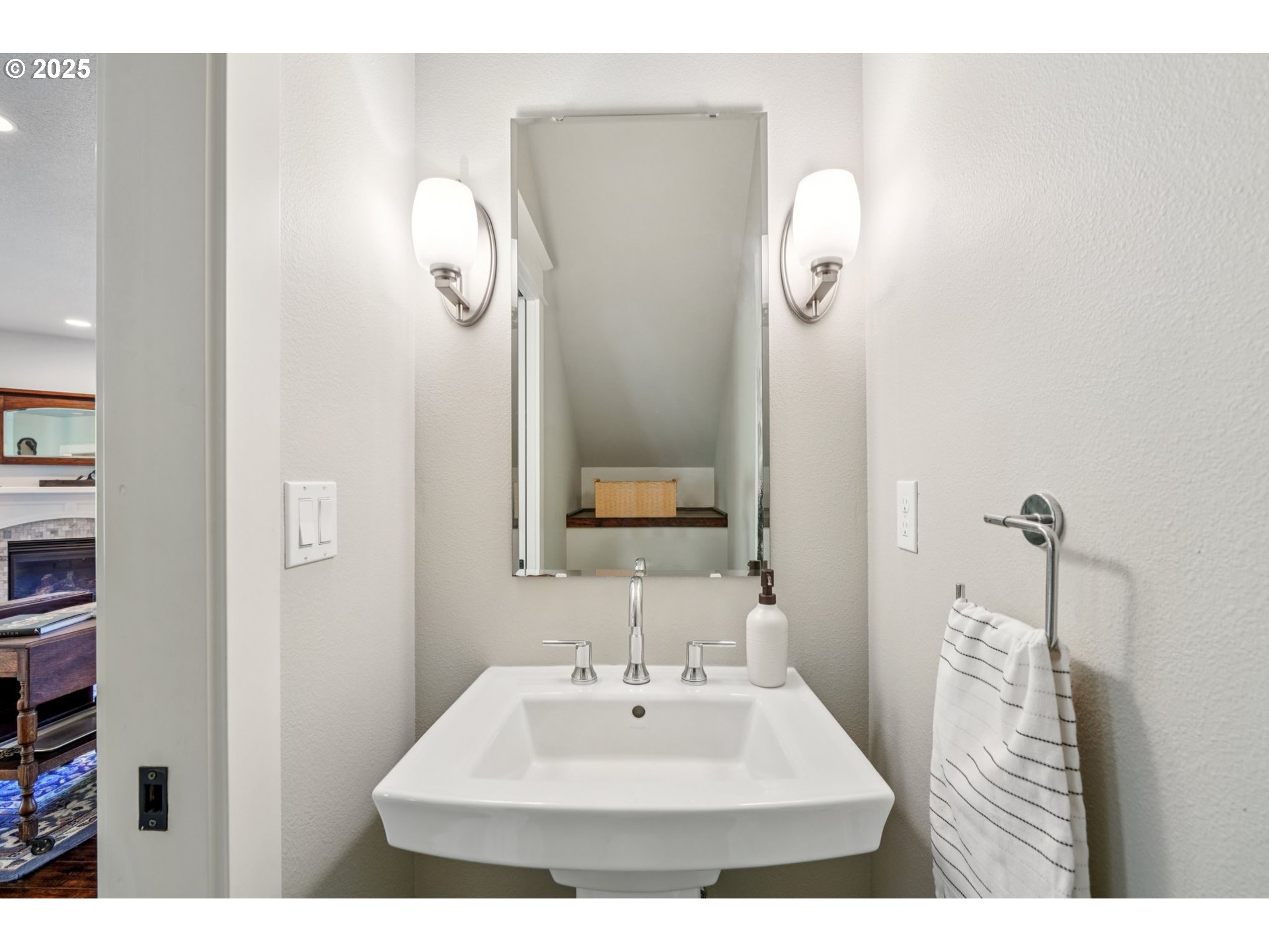 5862 Southwest Ralston Drive Portland, OR 97239 - Photo 15 of 41 a bathroom with a sink a mirror and vanity