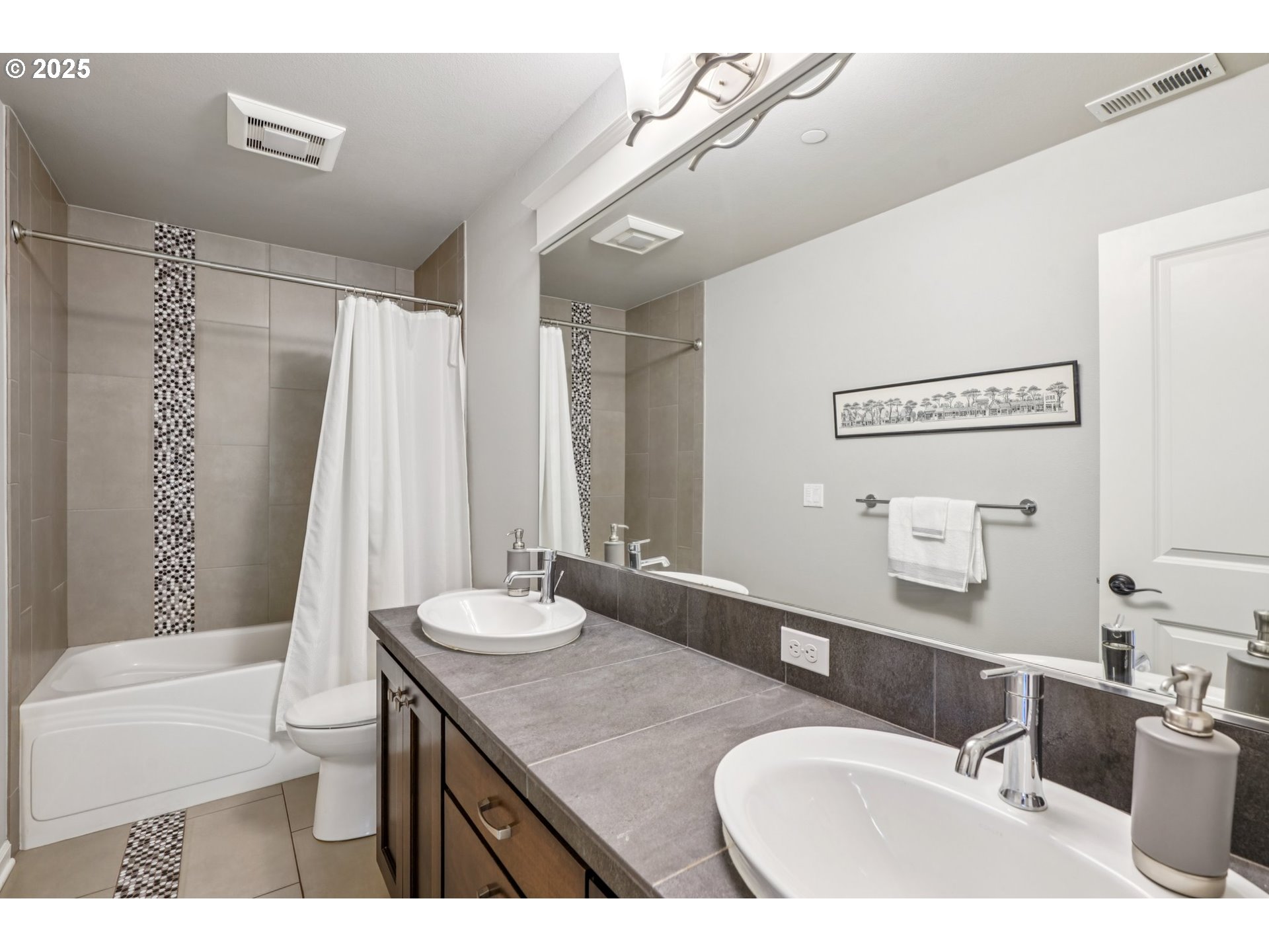 5862 Southwest Ralston Drive Portland, OR 97239 - Photo 28 of 41 a bathroom with a granite countertop sink a toilet a mirror and shower