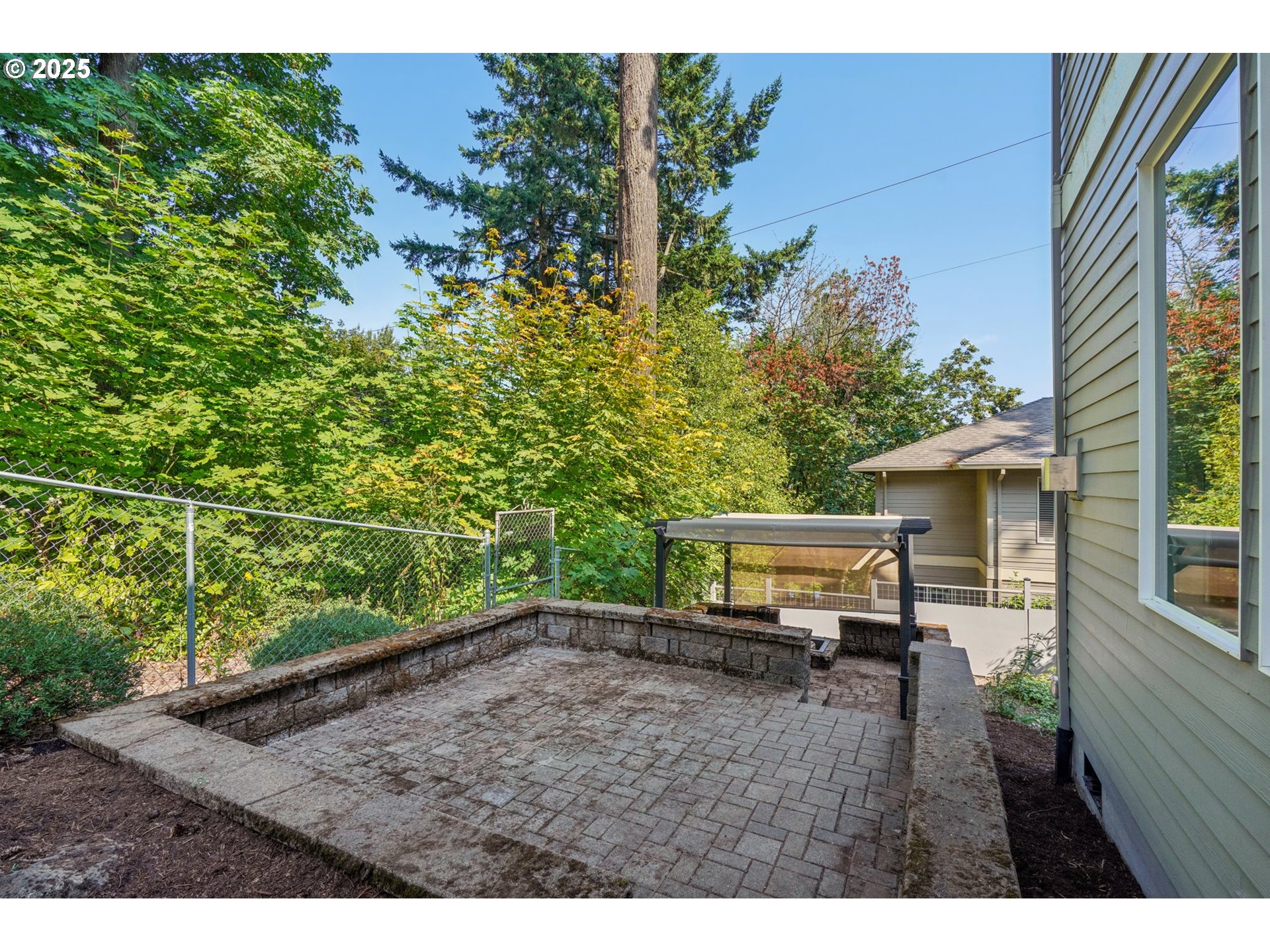5862 Southwest Ralston Drive Portland, OR 97239 - Photo 34 of 41 a view of a backyard with sitting area