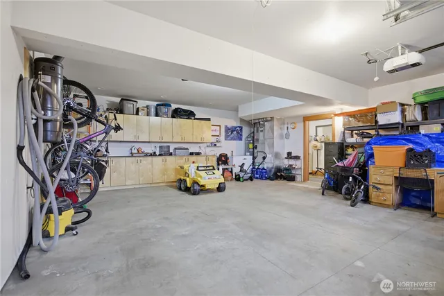 a view of a garage with a bike and car