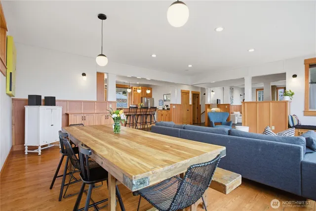 a dining room with furniture and wooden floor