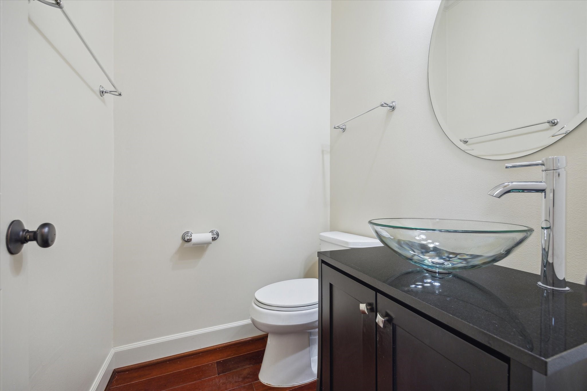 415 Tuam Street Houston, TX 77006 - Photo 12 of 21 a bathroom with a granite countertop toilet and a sink