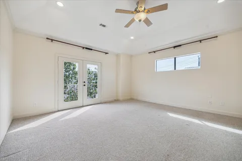 a spacious bathroom with a granite countertop double vanity sink a mirror and a bathtub