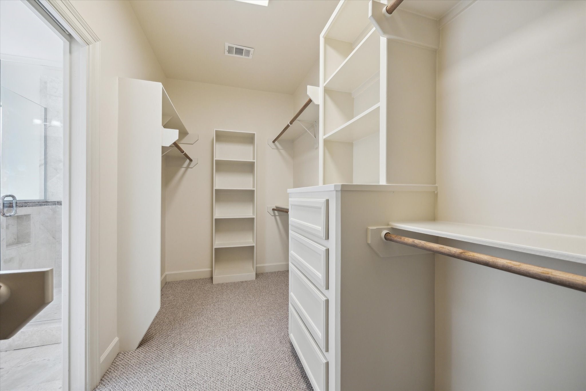 415 Tuam Street Houston, TX 77006 - Photo 16 of 21 a view of walk in closet with empty racks