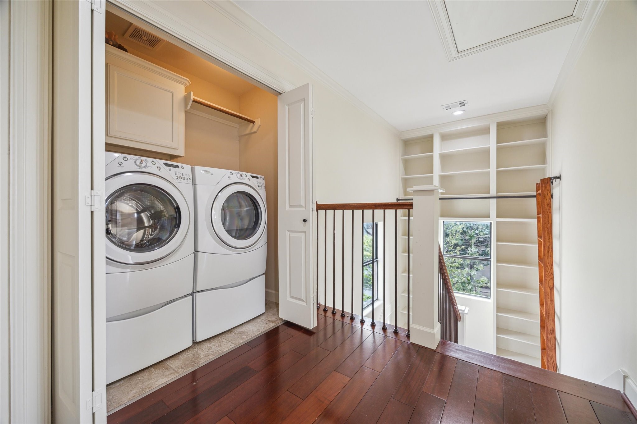 415 Tuam Street Houston, TX 77006 - Photo 19 of 21 a view of a storage & utility room with washer and dryer
