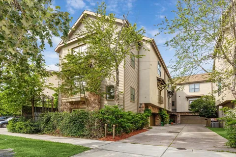 a view of a kitchen with wooden floor and a kitchen
