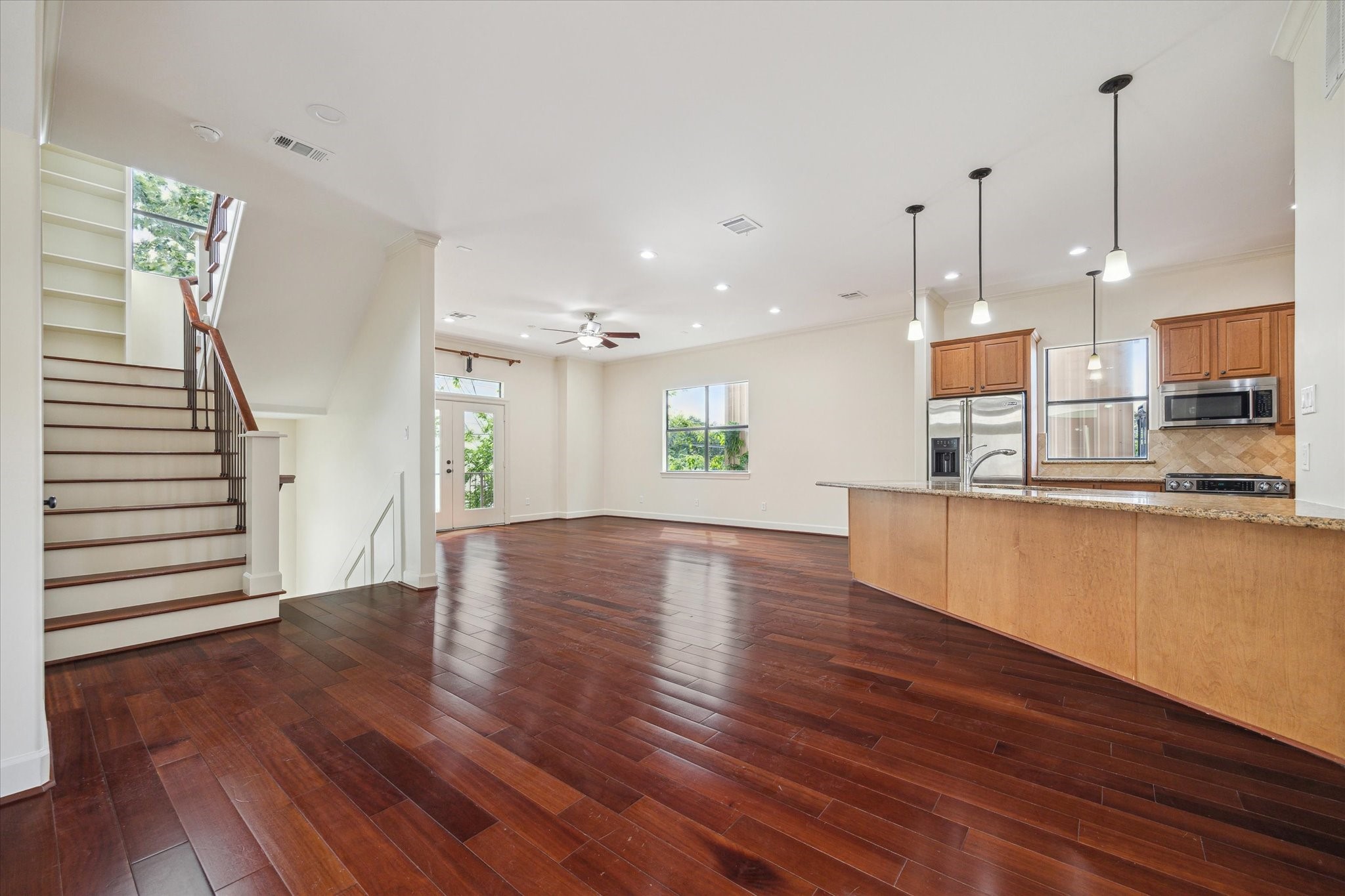415 Tuam Street Houston, TX 77006 - Photo 4 of 21 a view of a kitchen with wooden floor and a kitchen