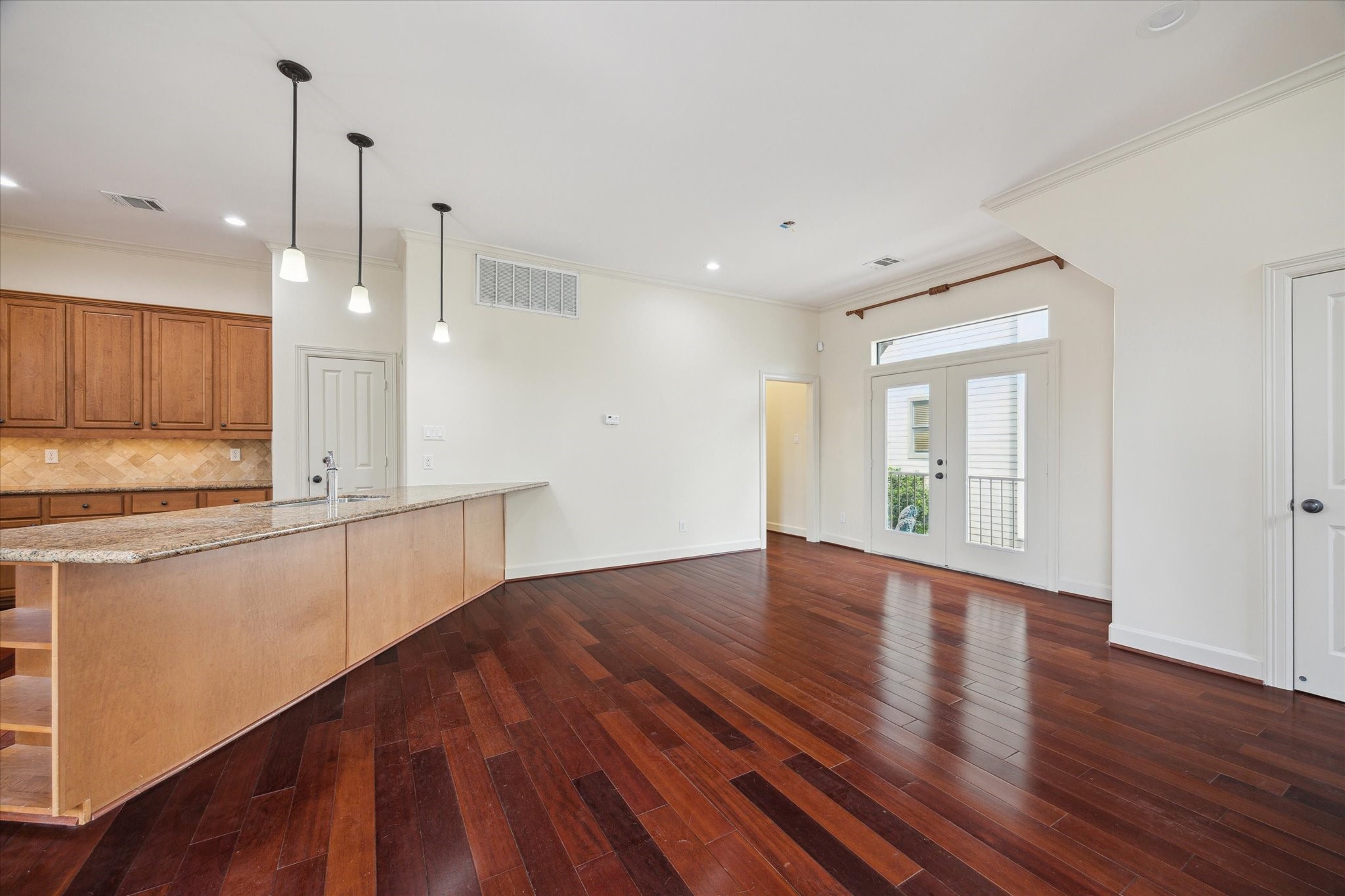 415 Tuam Street Houston, TX 77006 - Photo 5 of 21 a view of a kitchen with wooden floor and windows