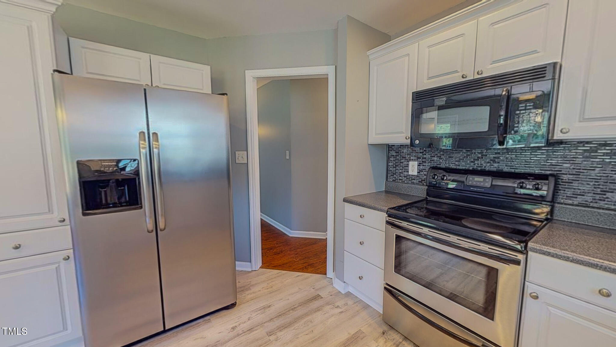 128 Punch Hill Farm Road Rougemont, NC 27572 - Photo 17 of 45 a kitchen with cabinets and stainless steel appliances