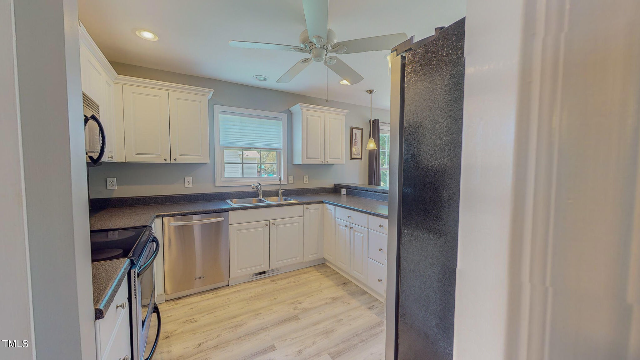 128 Punch Hill Farm Road Rougemont, NC 27572 - Photo 19 of 45 a kitchen with granite countertop white cabinets and white appliances