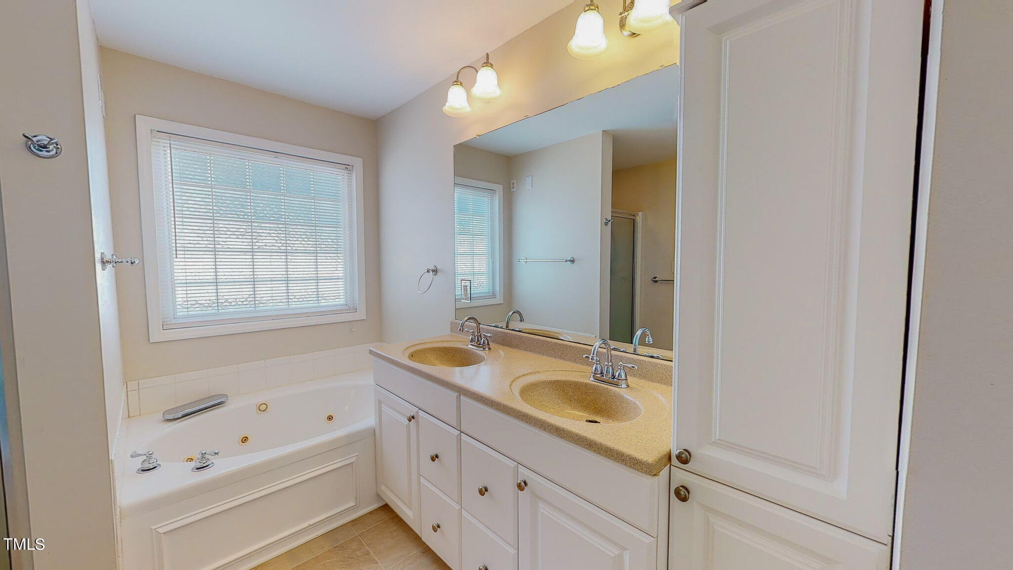 128 Punch Hill Farm Road Rougemont, NC 27572 - Photo 31 of 45 a bathroom with a bathtub sink and mirror