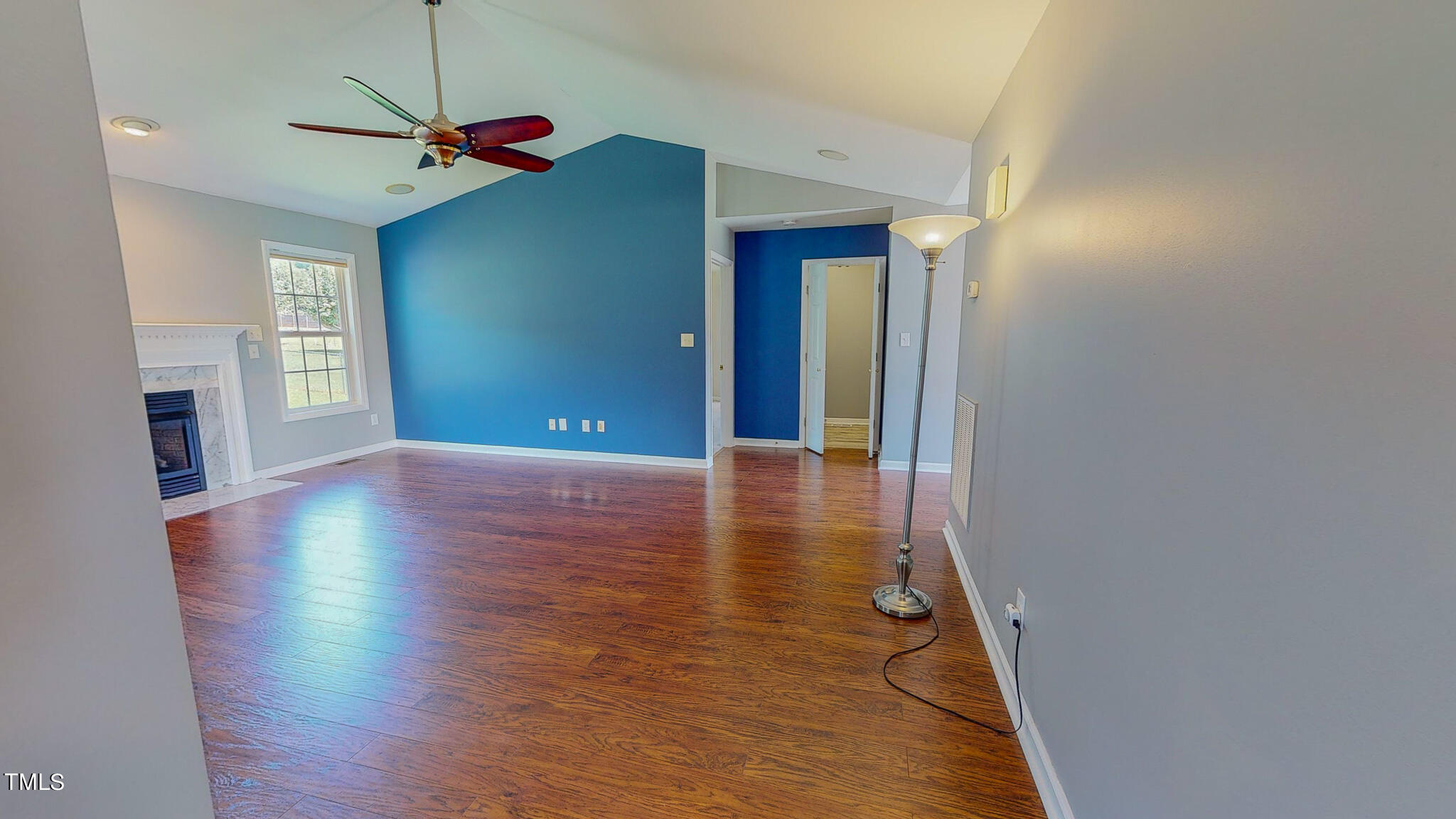 128 Punch Hill Farm Road Rougemont, NC 27572 - Photo 34 of 45 a view of a livingroom with wooden floor a ceiling fan and window