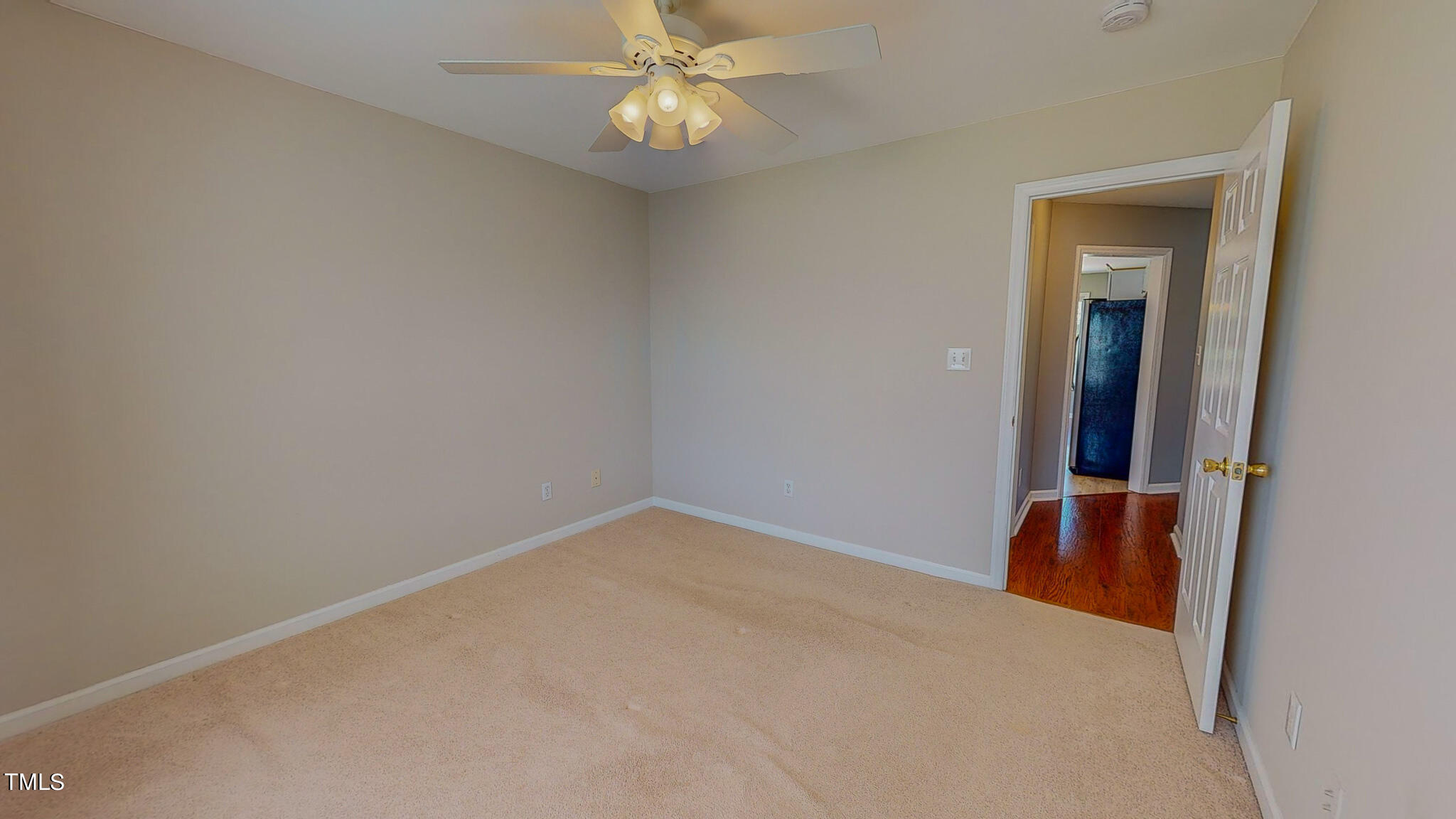 128 Punch Hill Farm Road Rougemont, NC 27572 - Photo 35 of 45 an empty room with a chandelier fan and a window