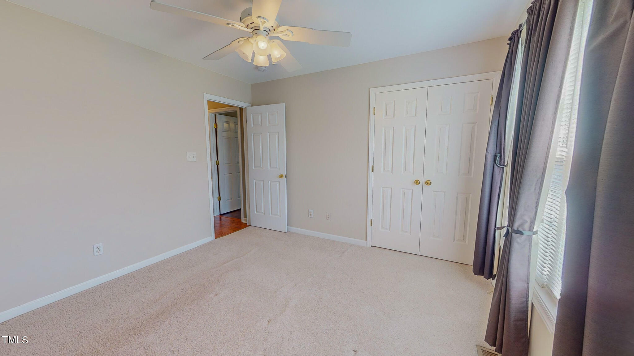 128 Punch Hill Farm Road Rougemont, NC 27572 - Photo 37 of 45 an empty room with windows and fan