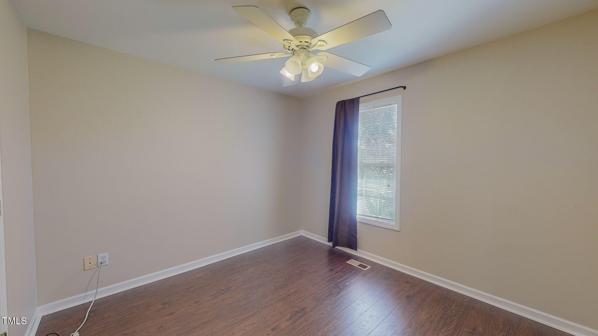 128 Punch Hill Farm Road Rougemont, NC 27572 - Photo 38 of 45 an empty room with window and hardwood floor