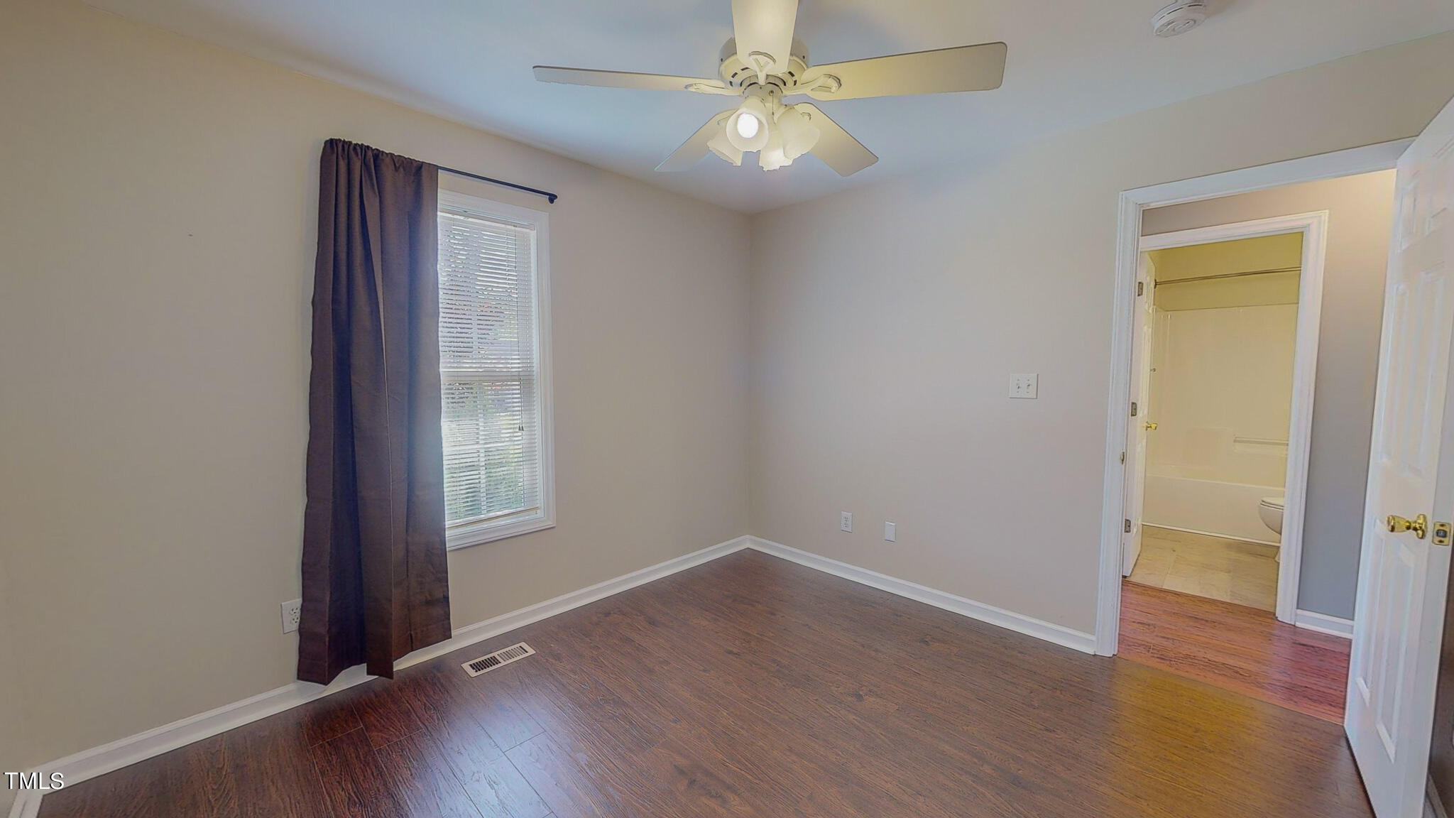 128 Punch Hill Farm Road Rougemont, NC 27572 - Photo 39 of 45 an empty room with wooden floor closet and windows