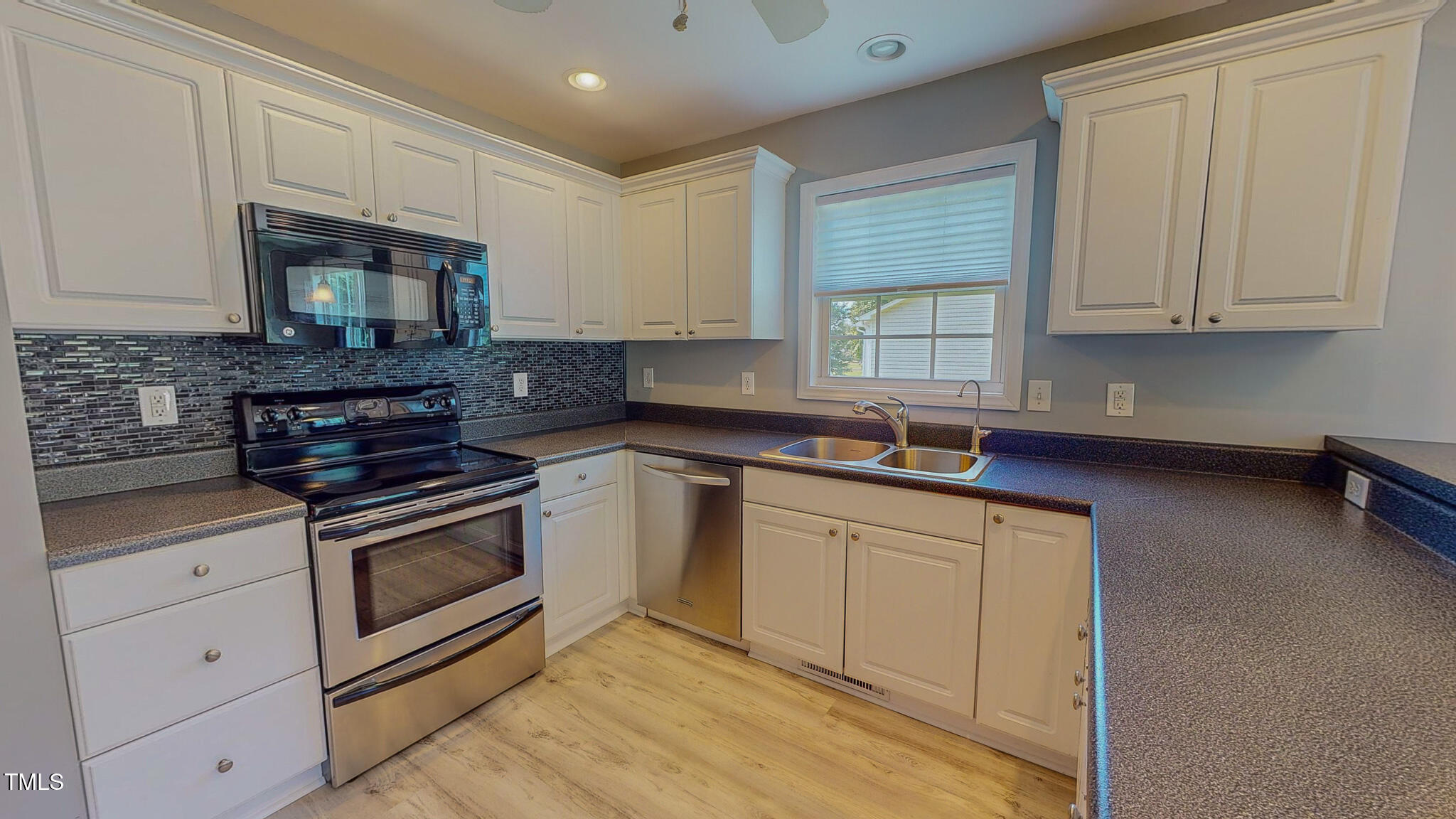 128 Punch Hill Farm Road Rougemont, NC 27572 - Photo 9 of 45 a kitchen with stainless steel appliances granite countertop a stove a sink and a microwave