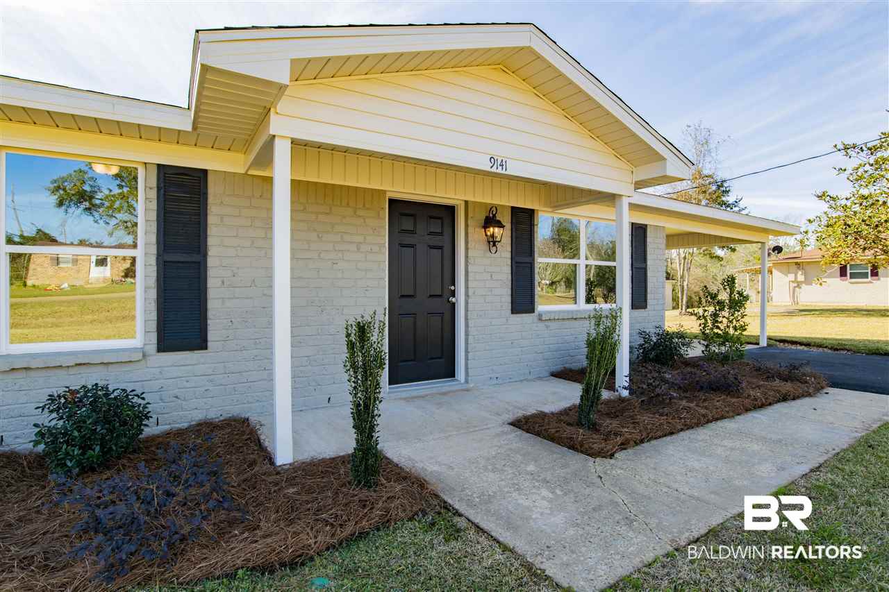 9141 Semmes Court Semmes, AL 36575 - Photo 2 of 28 New landscaping, painted brick and vinyl exterior.