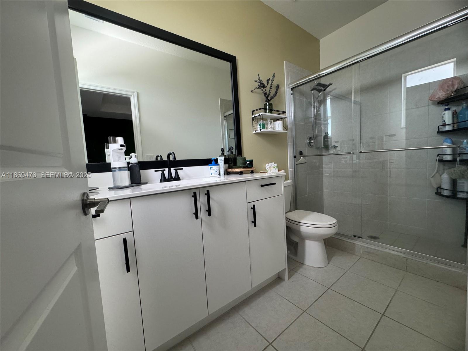 16270 Southwest 293rd Street Homestead, FL 33033 - Photo 12 of 13 a bathroom with a sink toilet and shower