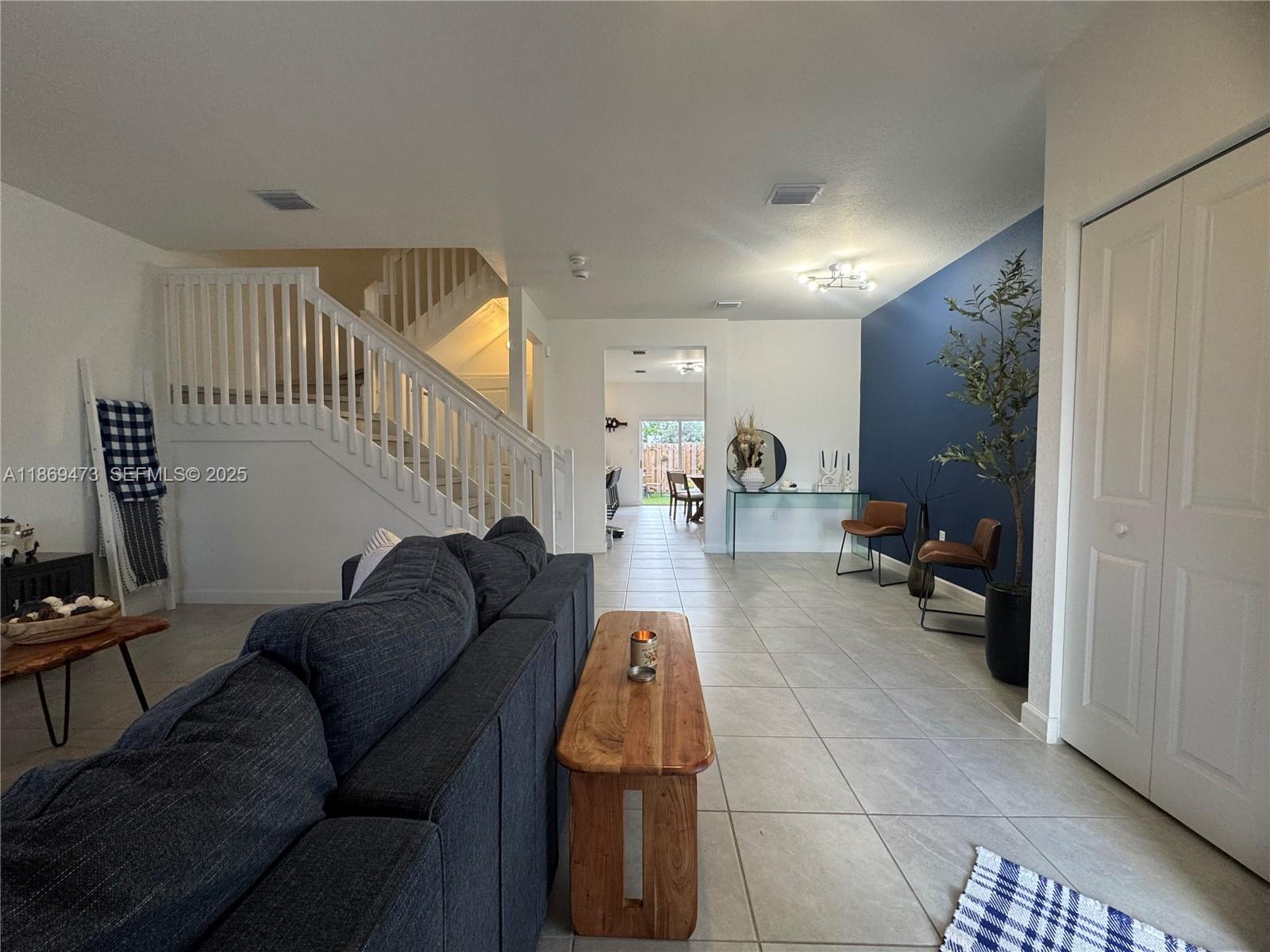 16270 Southwest 293rd Street Homestead, FL 33033 - Photo 3 of 13 a living room with furniture and a wooden floor