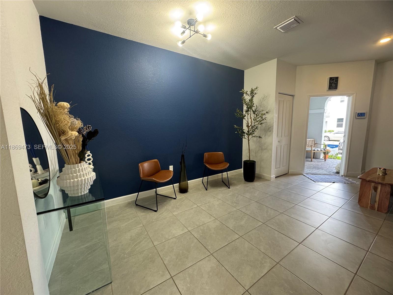16270 Southwest 293rd Street Homestead, FL 33033 - Photo 5 of 13 a view of a livingroom with furniture and a rug