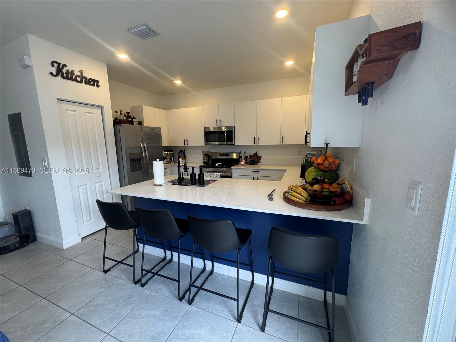 16270 Southwest 293rd Street Homestead, FL 33033 - Photo 7 of 13 a view of a dining room with furniture