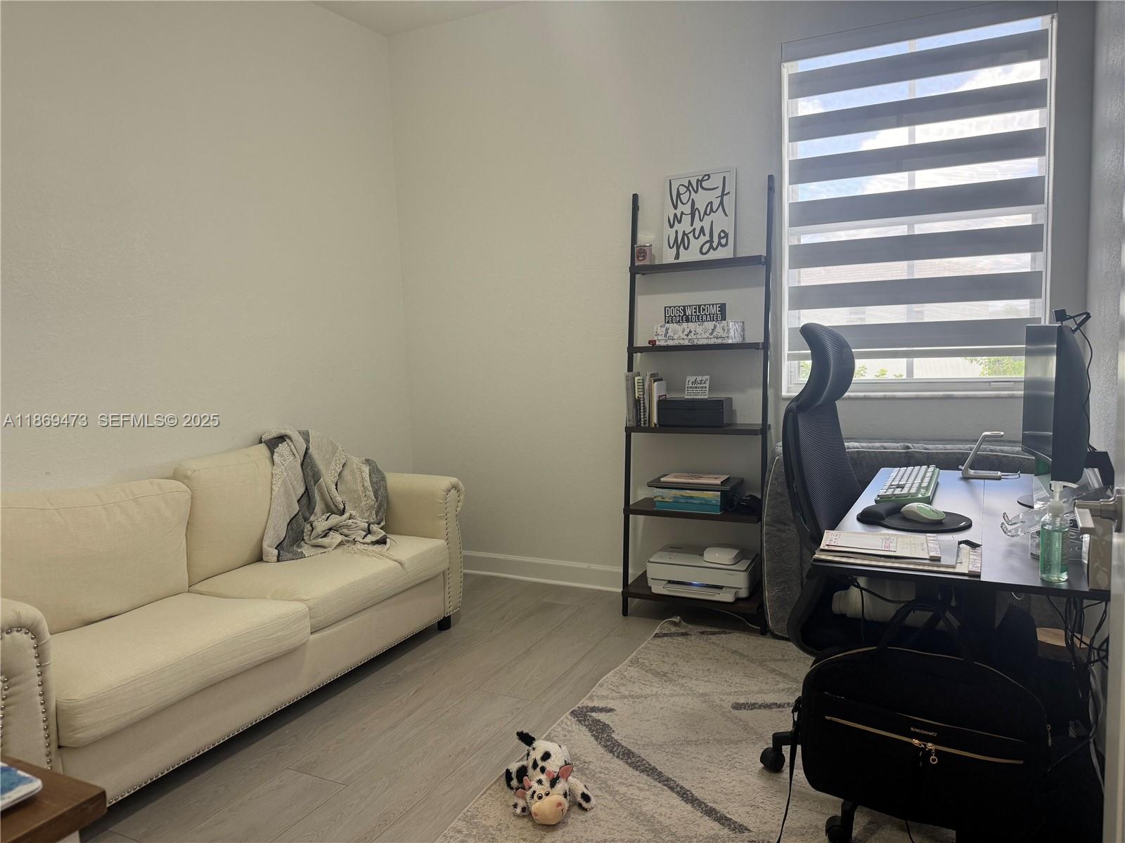 16270 Southwest 293rd Street Homestead, FL 33033 - Photo 8 of 13 a living room with furniture and a window