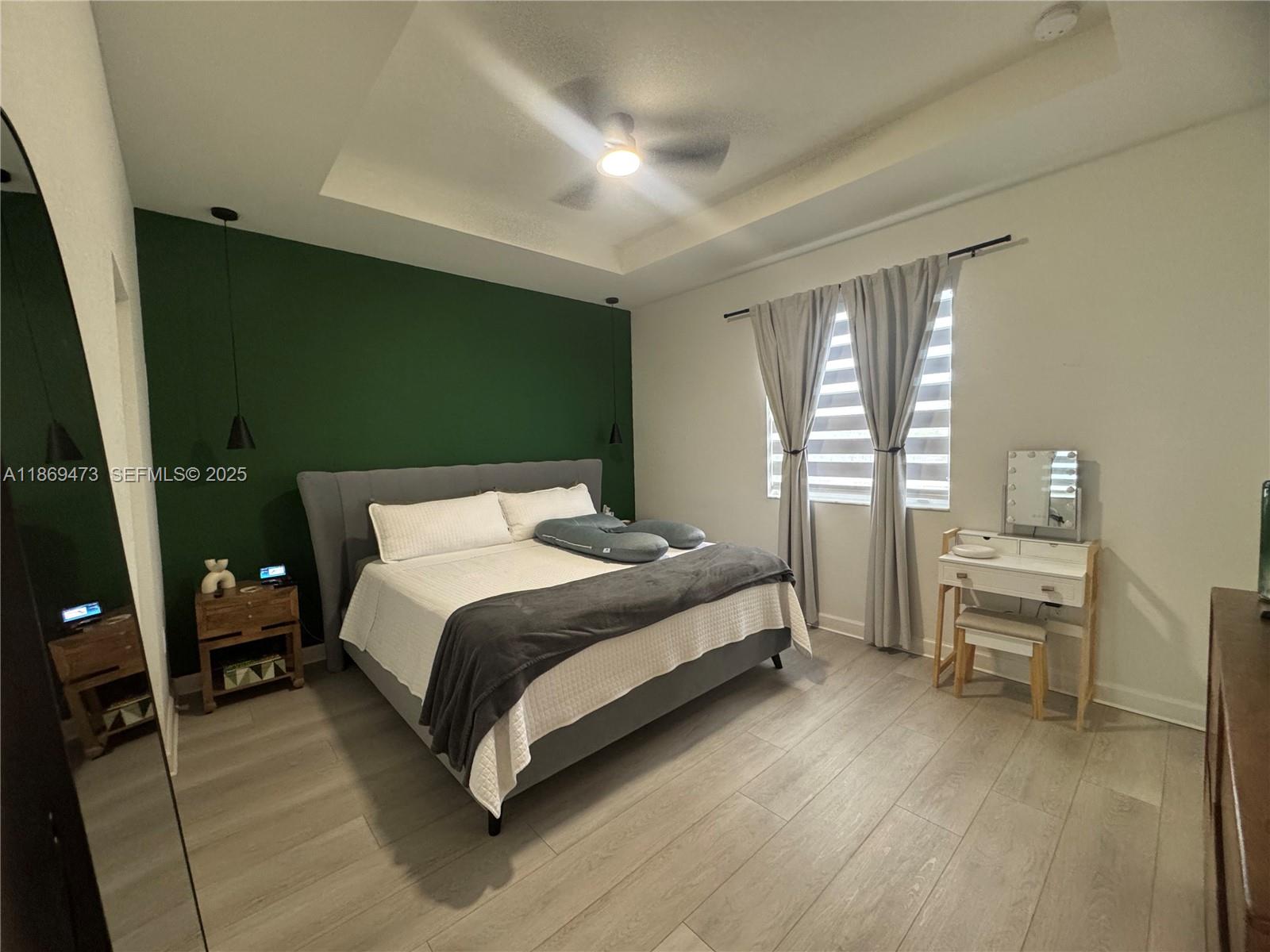 16270 Southwest 293rd Street Homestead, FL 33033 - Photo 9 of 13 a bed room with a bed and a chair