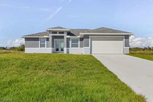 a front view of a house with a garden and yard