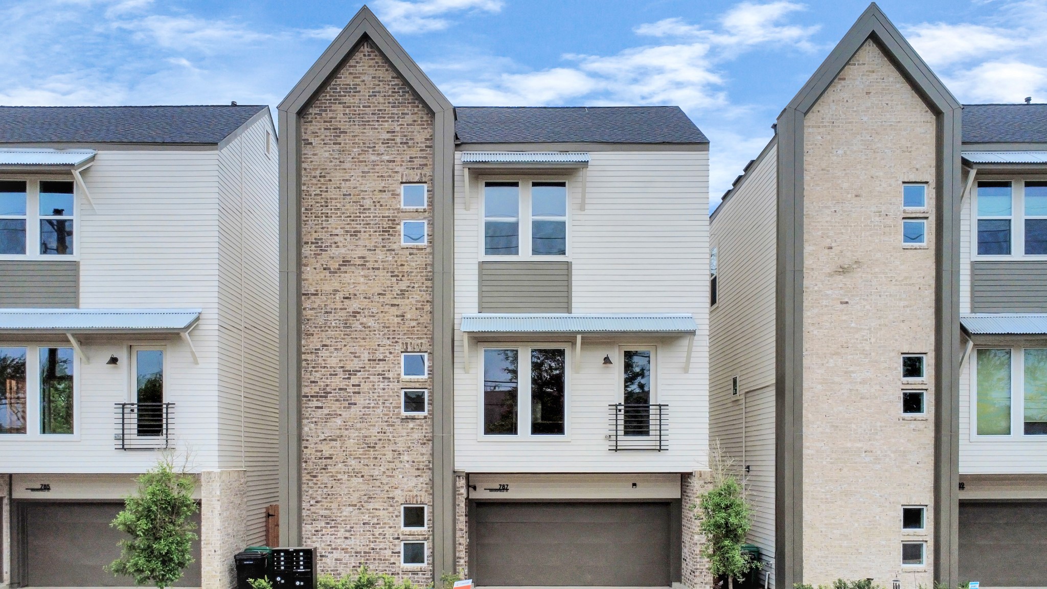 a front view of a house with white walls