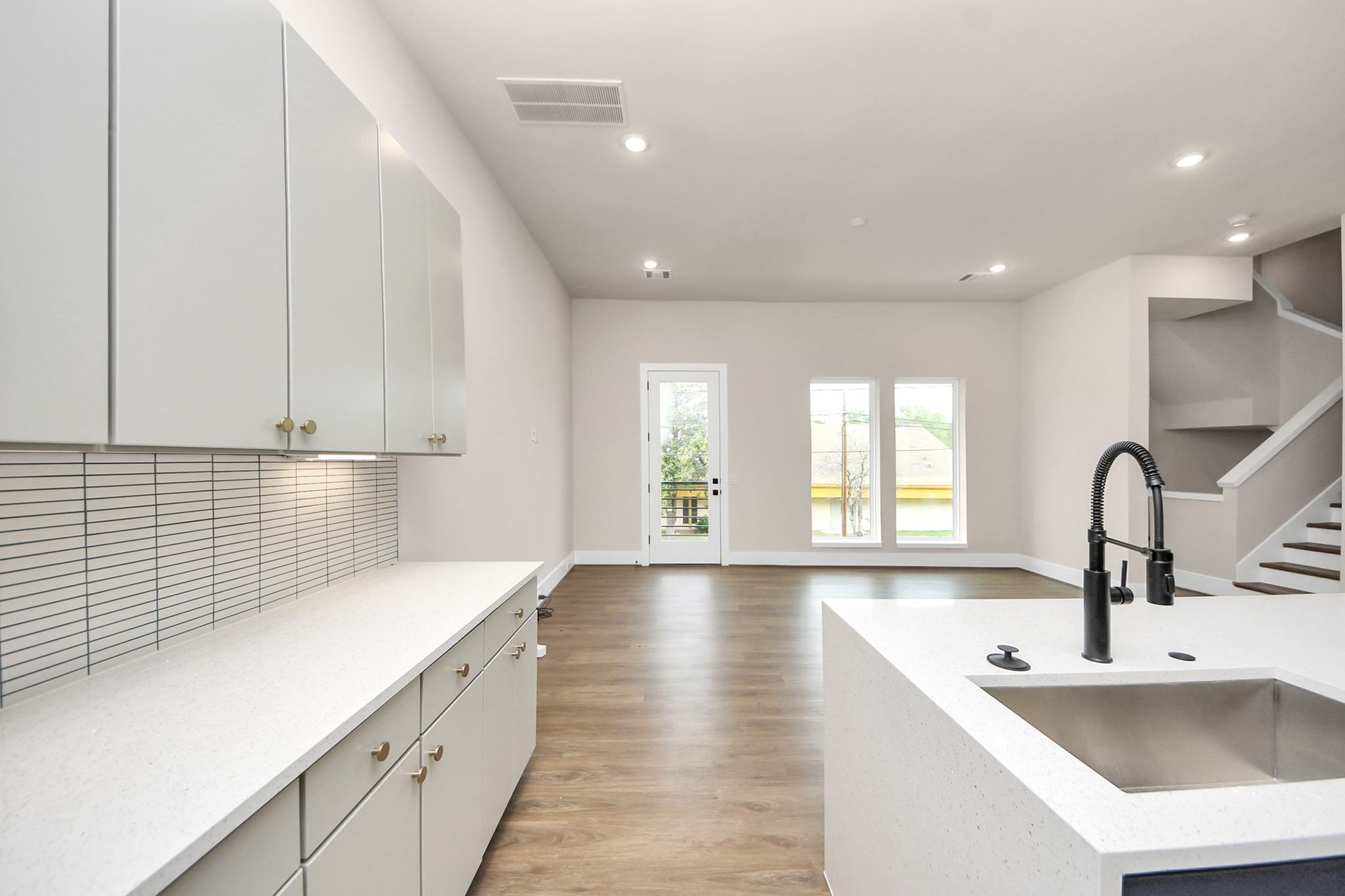 783 Mansfield Street Houston, TX 77091 - Photo 19 of 40 a large kitchen with stainless steel appliances a sink dishwasher and cabinets next to a window