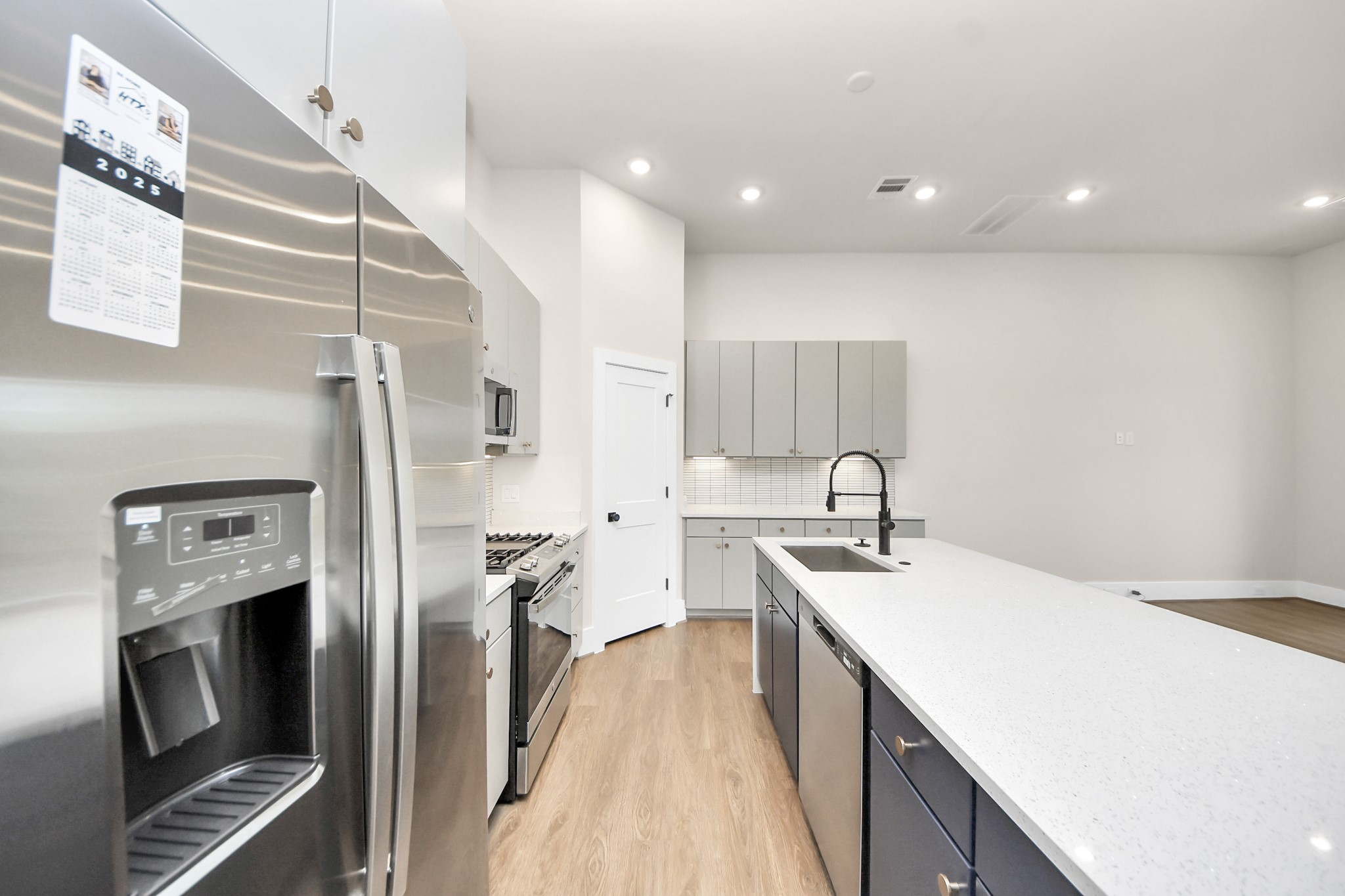 783 Mansfield Street Houston, TX 77091 - Photo 21 of 40 a kitchen with a sink appliances and cabinets