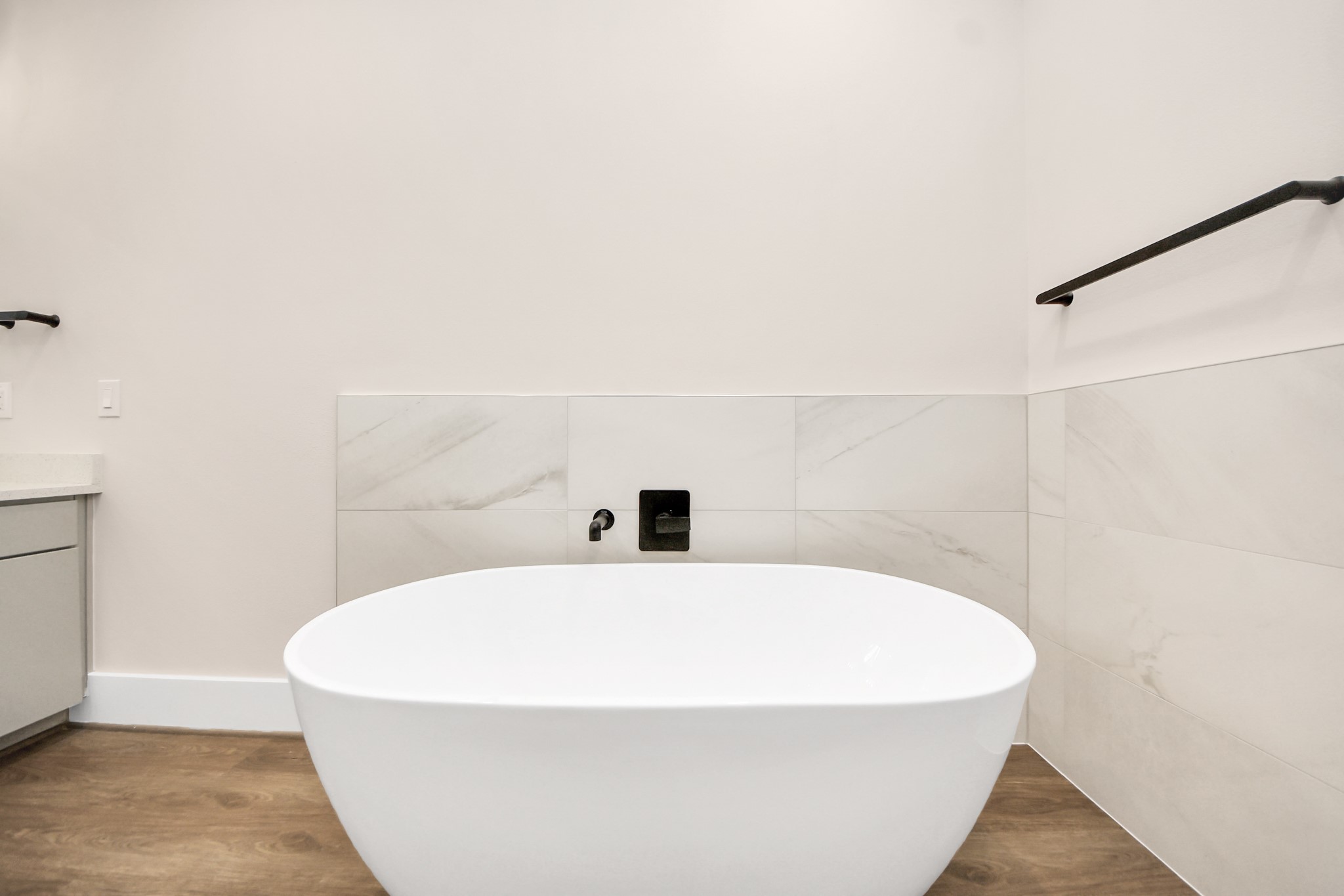 783 Mansfield Street Houston, TX 77091 - Photo 32 of 40 a white bath tub sitting in a bathroom