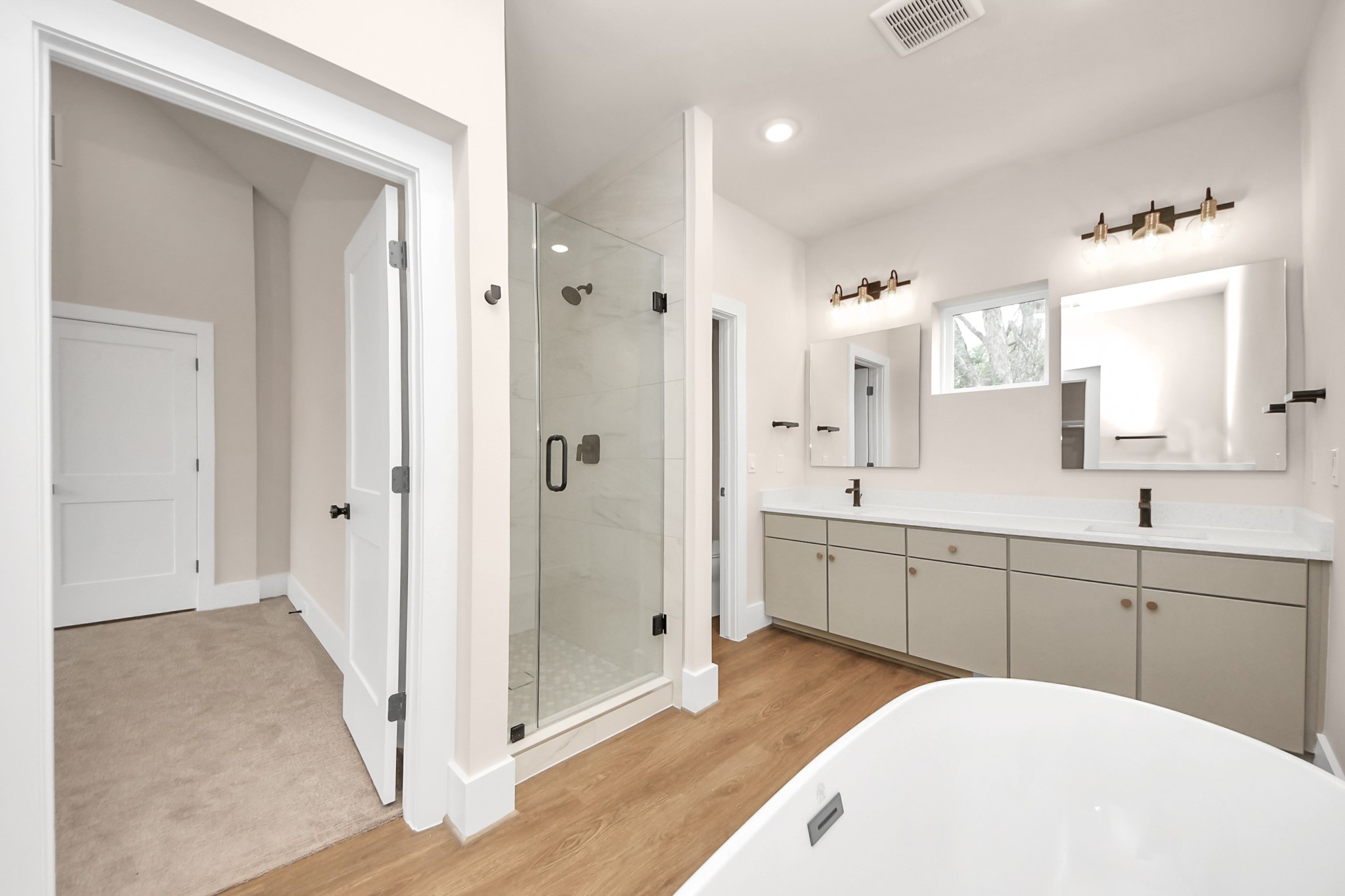 783 Mansfield Street Houston, TX 77091 - Photo 35 of 40 a spacious bathroom with a sink a shower and a mirror