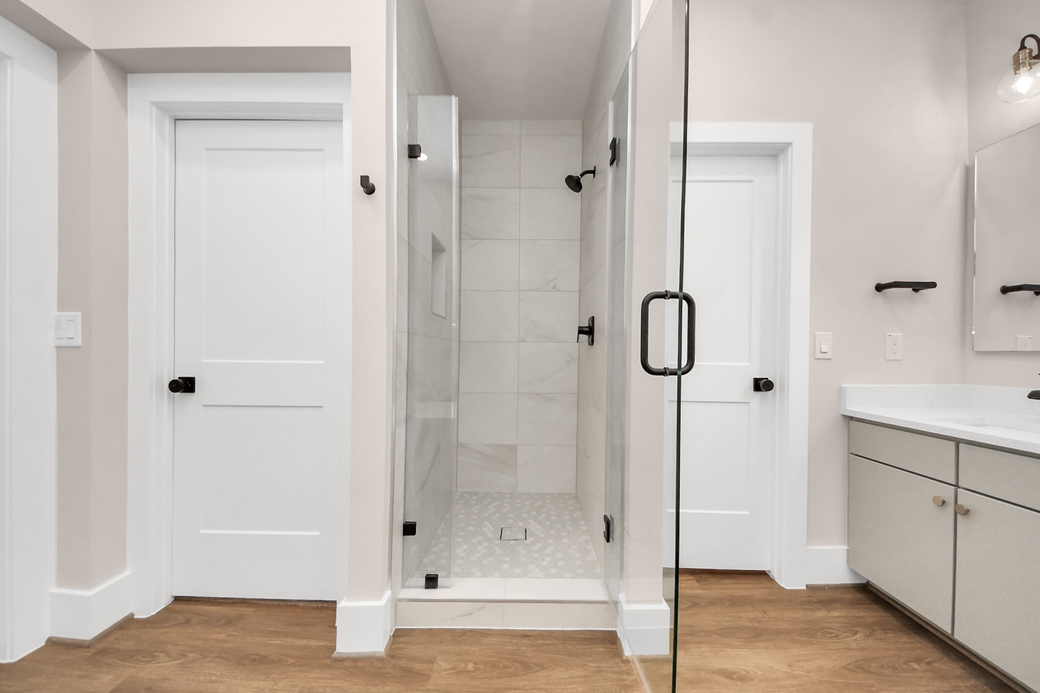 783 Mansfield Street Houston, TX 77091 - Photo 37 of 40 a bathroom with a glass shower door