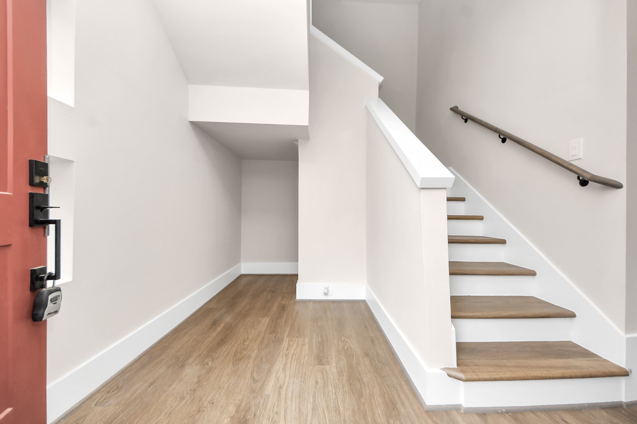 783 Mansfield Street Houston, TX 77091 - Photo 4 of 40 a view of entryway and hall with wooden floor