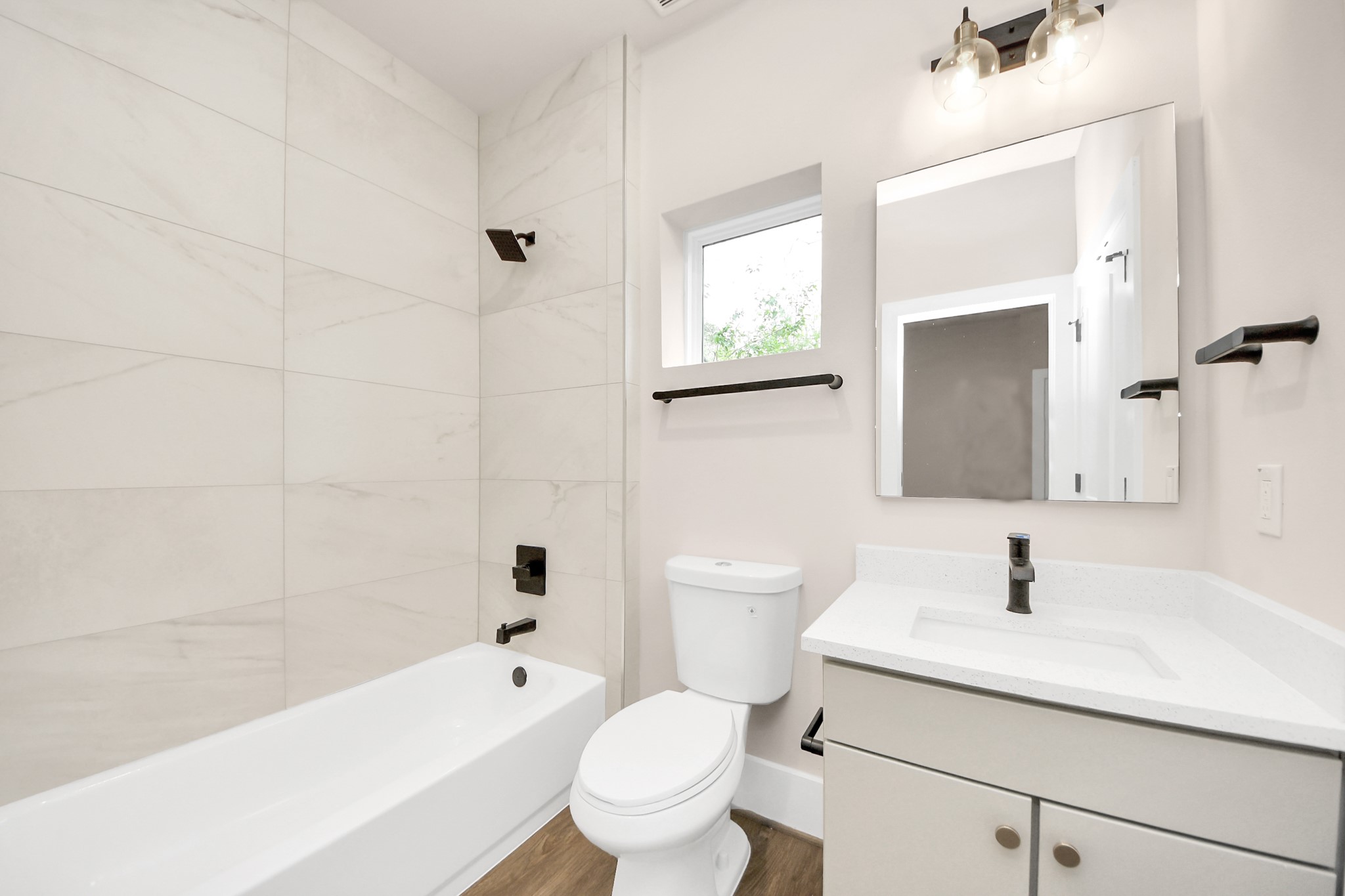 783 Mansfield Street Houston, TX 77091 - Photo 7 of 40 a bathroom with a sink a toilet and shower