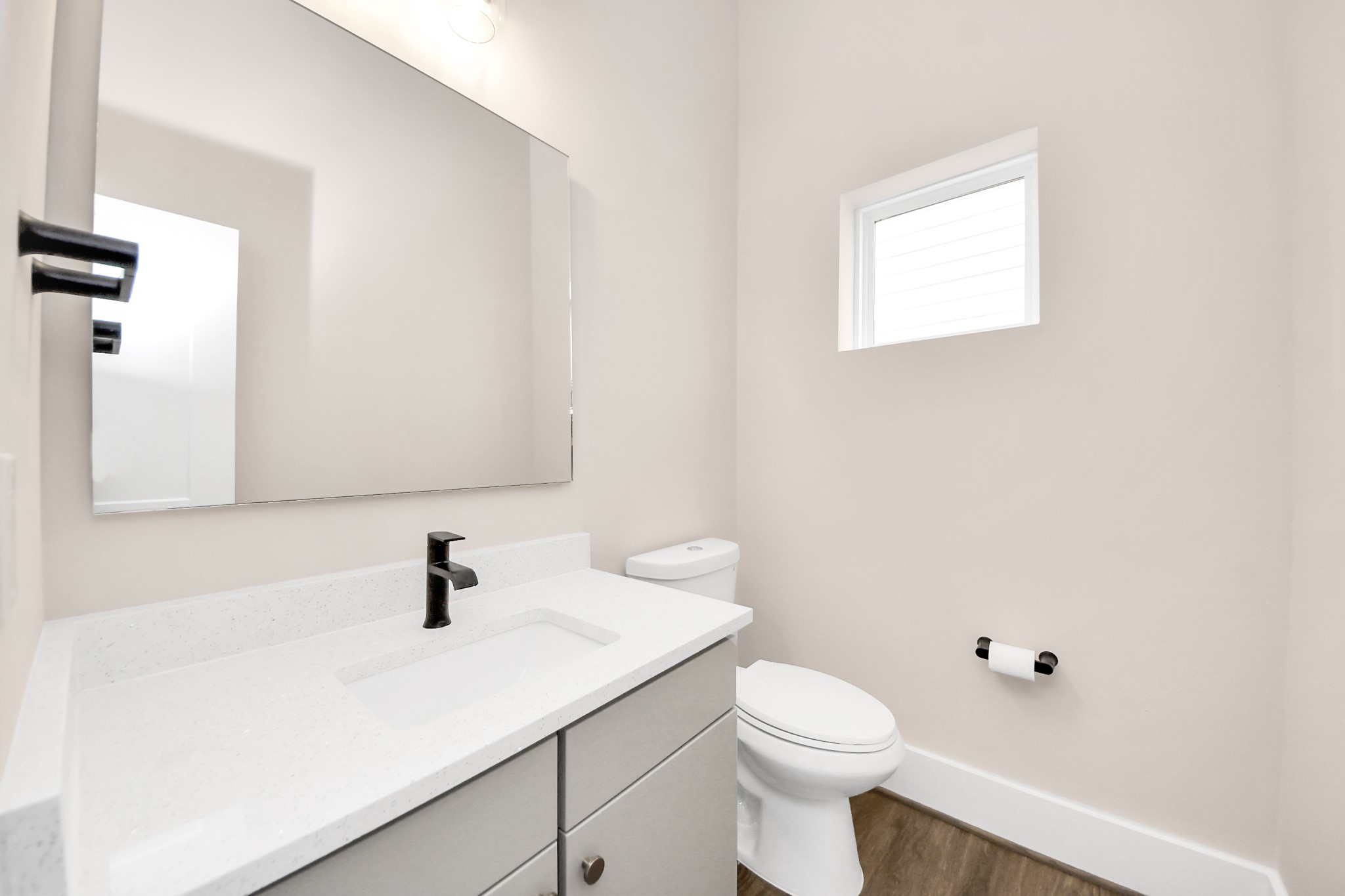 783 Mansfield Street Houston, TX 77091 - Photo 10 of 40 a bathroom with a sink a toilet and mirror