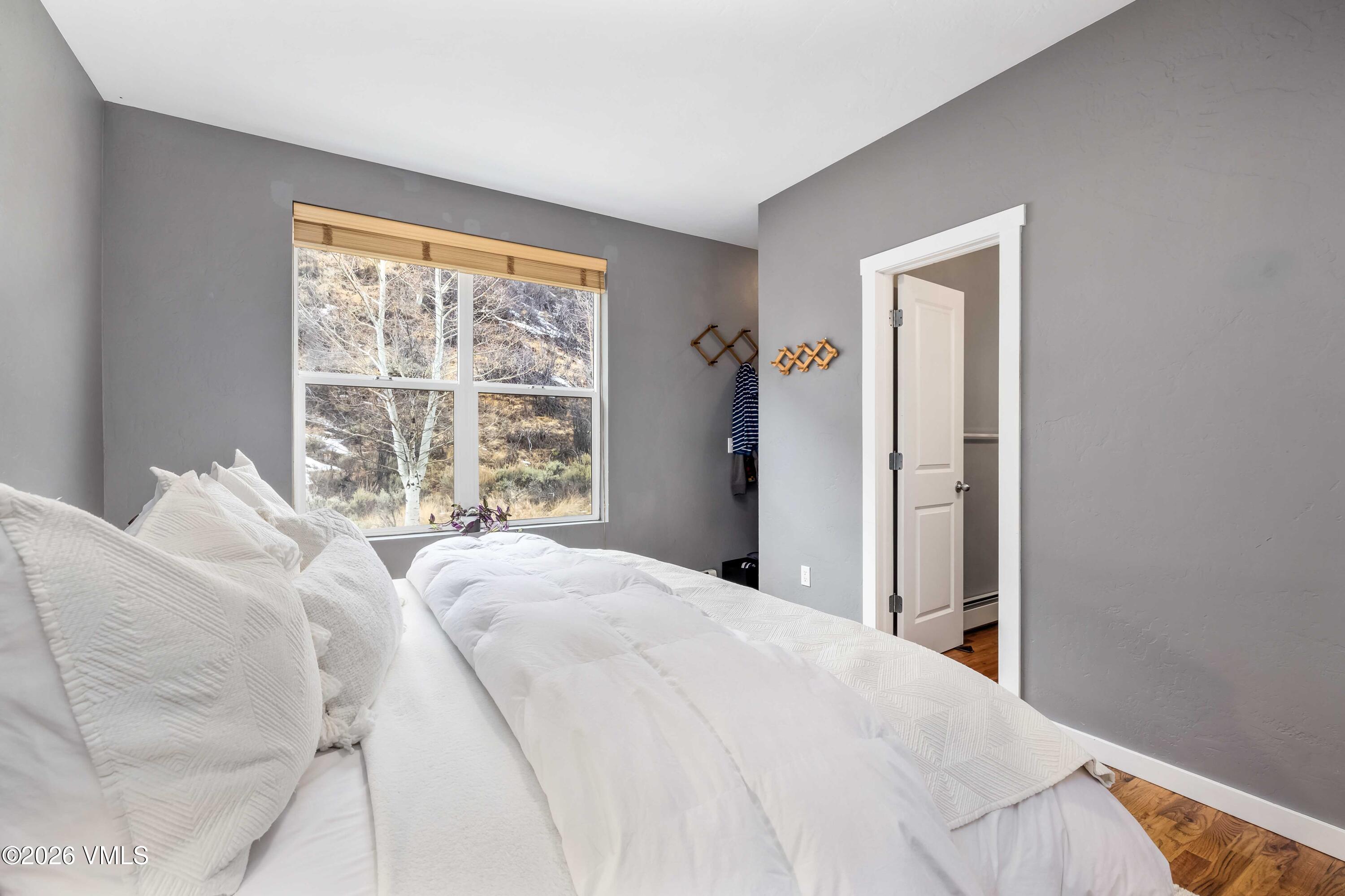 491 Metcalf Road, Unit A2 Avon, CO 81620 - Photo 11 of 23 a bedroom with a bed and a window