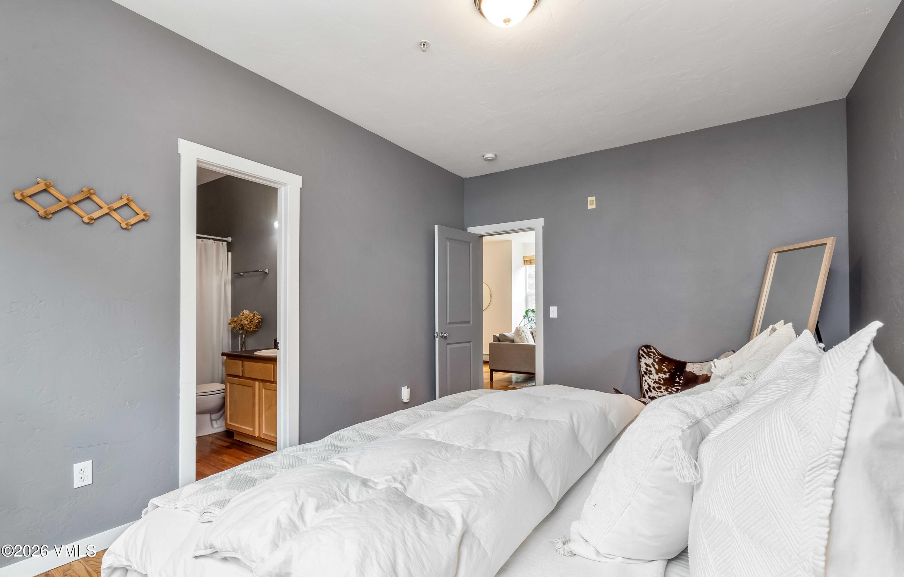 491 Metcalf Road, Unit A2 Avon, CO 81620 - Photo 12 of 23 a bedroom with a bed and a window