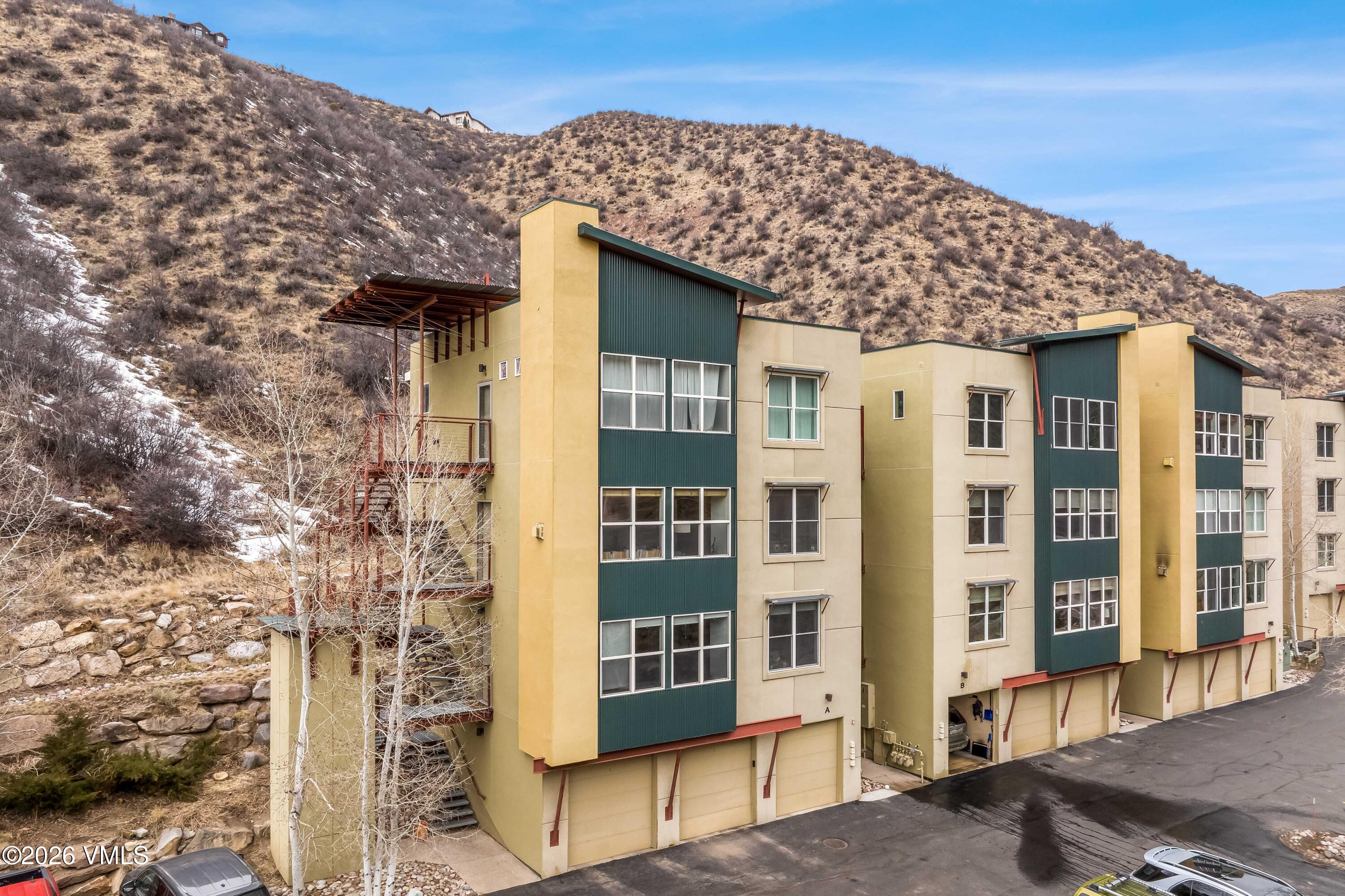491 Metcalf Road, Unit A2 Avon, CO 81620 - Photo 19 of 23 a front view of a building with a tree