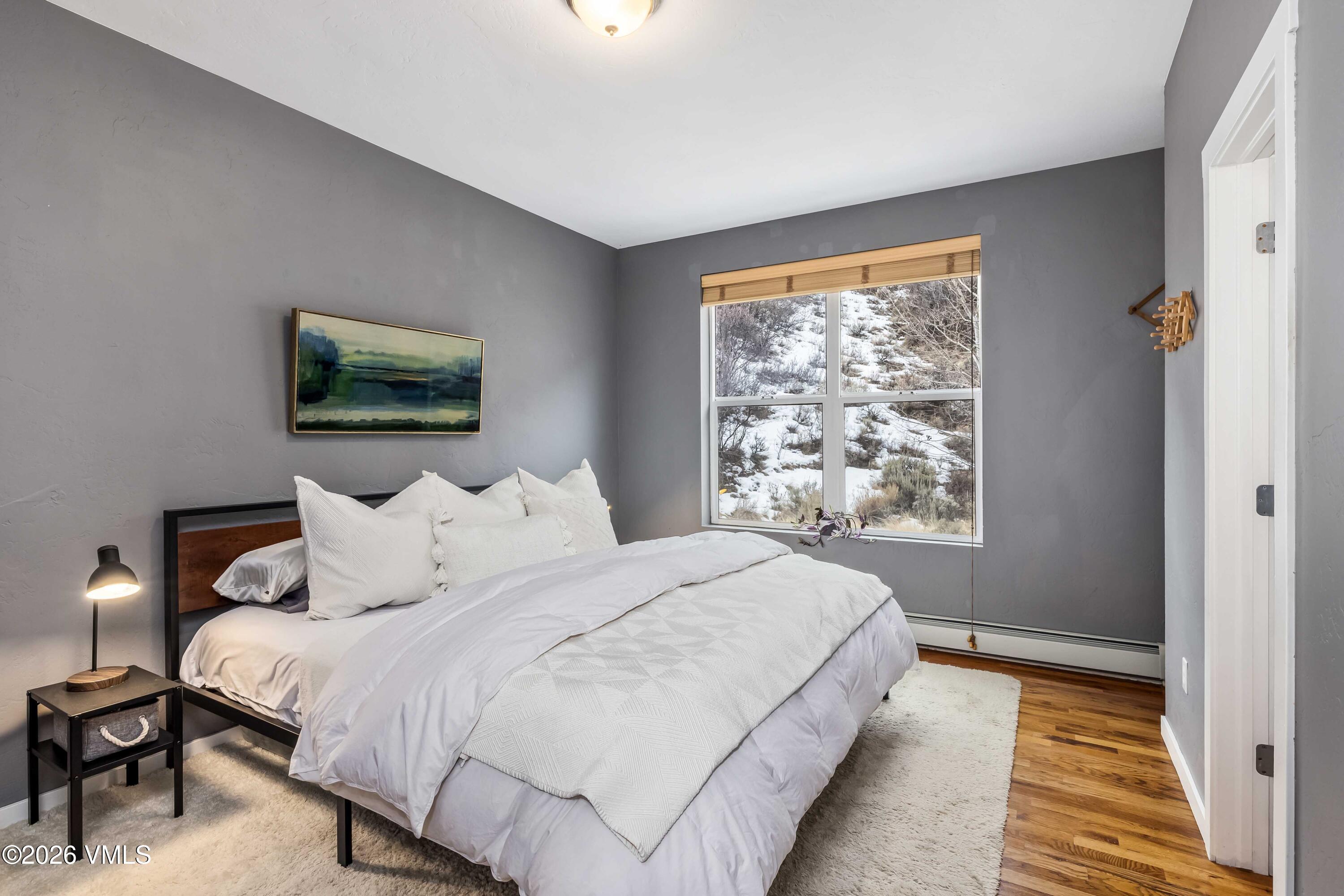 491 Metcalf Road, Unit A2 Avon, CO 81620 - Photo 10 of 23 a bedroom with a bed and a window