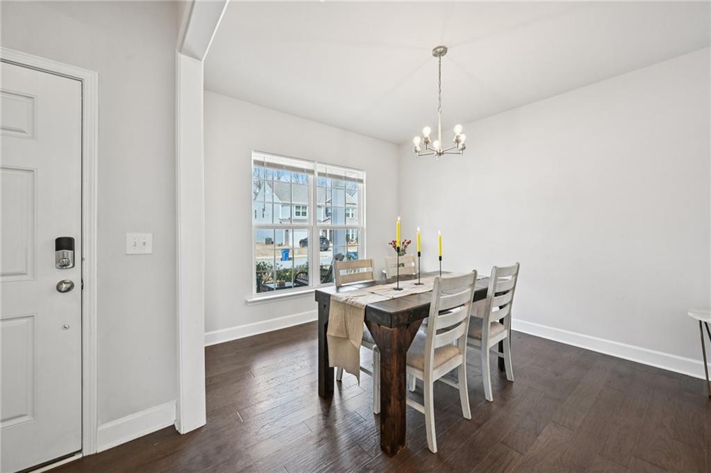 1283 Maston Road Auburn, GA 30011 - Photo 15 of 82 a view of a dining room with furniture window and wooden floor