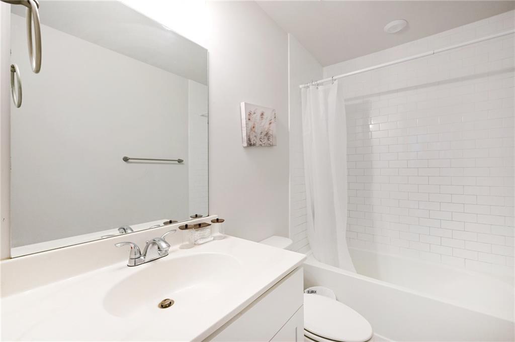 1283 Maston Road Auburn, GA 30011 - Photo 37 of 82 a bathroom with a sink toilet and shower