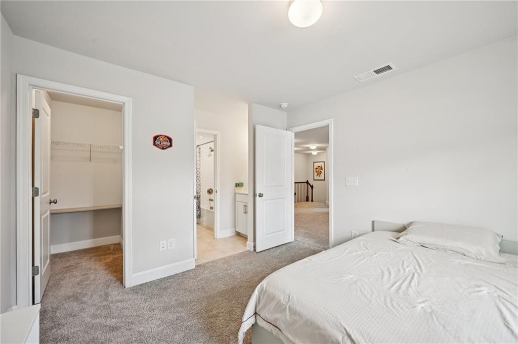 1283 Maston Road Auburn, GA 30011 - Photo 40 of 82 a spacious bedroom with a bed and a shower