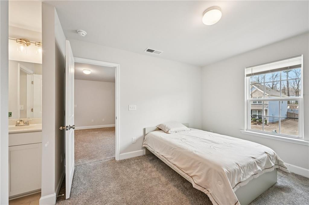 1283 Maston Road Auburn, GA 30011 - Photo 42 of 82 a bedroom with a bed and a window